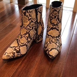 Quipid faux snakeskin booties.